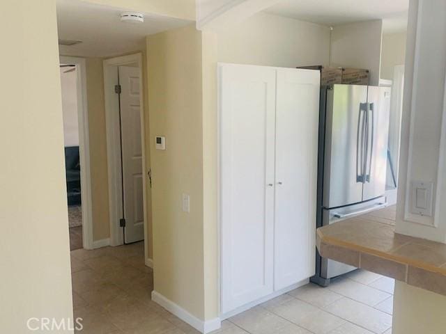 23266 Via Ronda, Mission Viejo, CA 92691 - kitchen with freestanding refrigerator, light tile patterned floors, and tile counters