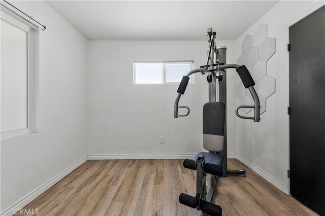 455 E Wilson St, Rialto, CA 92376 - workout room with wood finished floors and baseboards