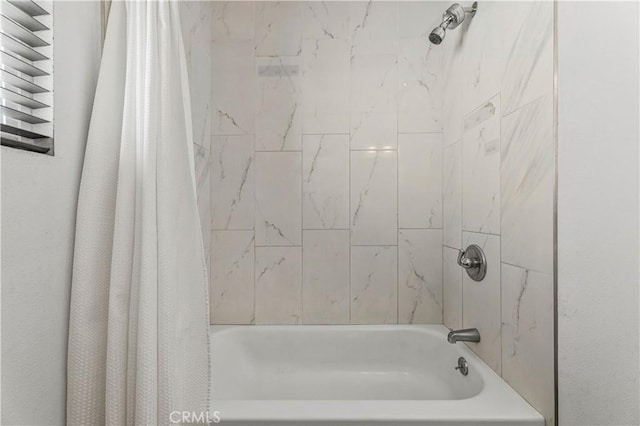 455 E Wilson St, Rialto, CA 92376 - bathroom featuring shower / bath combo with shower curtain