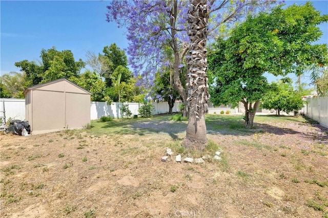 455 E Wilson St, Rialto, CA 92376 - fenced backyard featuring a storage unit
