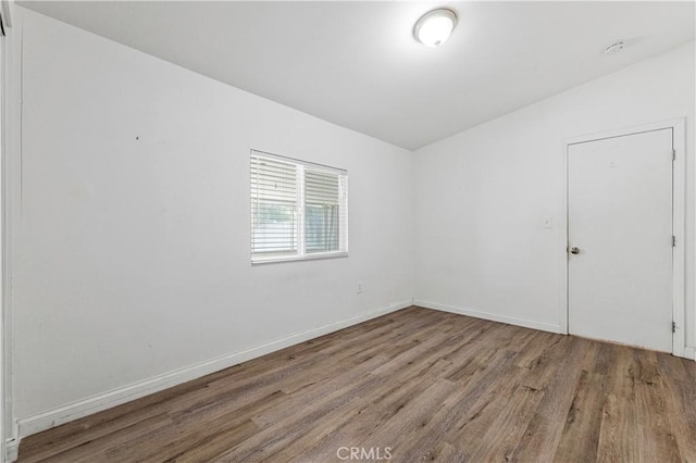 455 E Wilson St, Rialto, CA 92376 - empty room with wood finished floors and baseboards