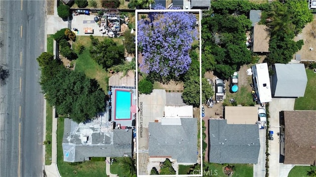 455 E Wilson St, Rialto, CA 92376 - aerial view of property and surrounding area featuring property boundaries highlighted and a pool area