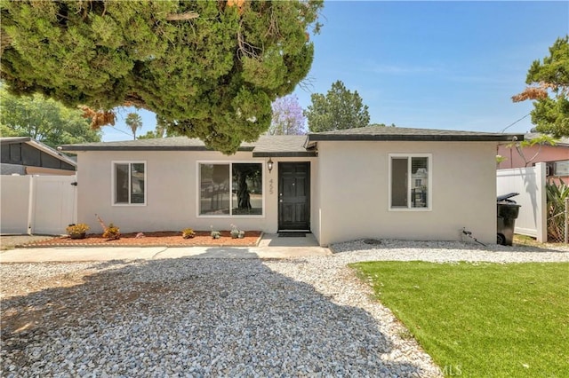 455 E Wilson St, Rialto, CA 92376 - single story home with stucco siding and roof with shingles