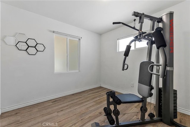 455 E Wilson St, Rialto, CA 92376 - workout room featuring wood finished floors and baseboards