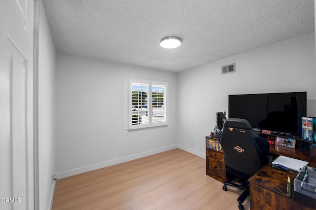 6552 Neddy Ave, West Hills, CA 91307 - home office with wood finished floors and a textured ceiling