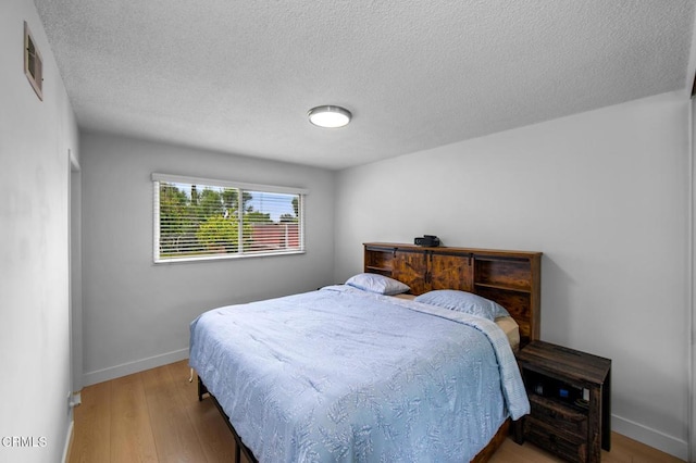6552 Neddy Ave, West Hills, CA 91307 - bedroom with wood finished floors and a textured ceiling