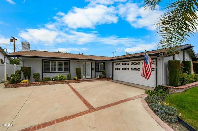 6552 Neddy Ave, West Hills, CA 91307 - ranch-style house featuring stucco siding, concrete driveway, an attached garage, and a chimney