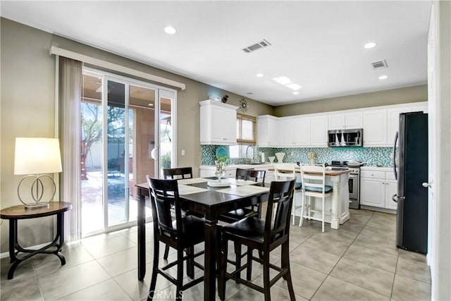 11543 Sky Pointe Dr, Desert Hot Springs, CA 92240 - dining area featuring light tile patterned flooring and recessed lighting