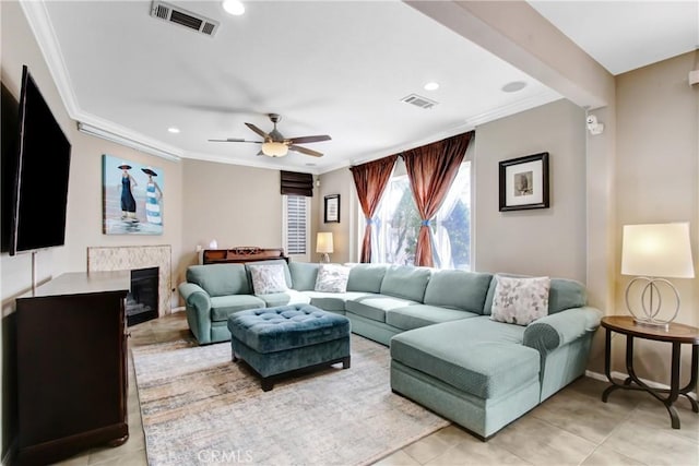 11543 Sky Pointe Dr, Desert Hot Springs, CA 92240 - living room featuring crown molding, recessed lighting, light tile patterned flooring, a ceiling fan, and a glass covered fireplace