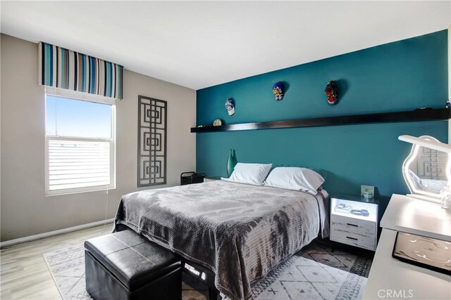 11543 Sky Pointe Dr, Desert Hot Springs, CA 92240 - bedroom featuring wood finished floors and baseboards