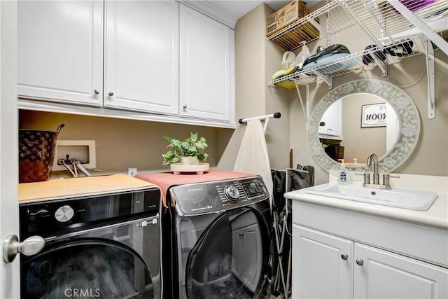 11543 Sky Pointe Dr, Desert Hot Springs, CA 92240 - washroom with washer and dryer and cabinet space