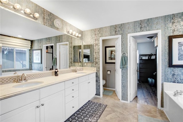 11543 Sky Pointe Dr, Desert Hot Springs, CA 92240 - bathroom with wallpapered walls, double vanity, and a bath