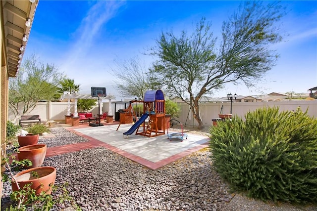 11543 Sky Pointe Dr, Desert Hot Springs, CA 92240 - fenced backyard with a playground and a patio area