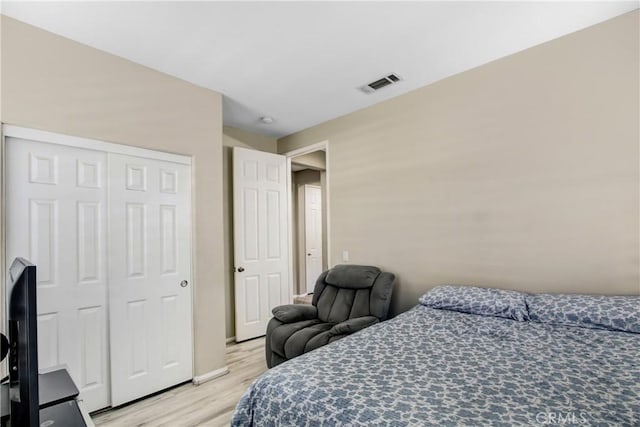11543 Sky Pointe Dr, Desert Hot Springs, CA 92240 - bedroom with light wood finished floors and a closet