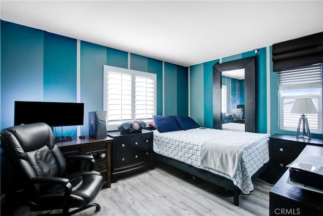 11543 Sky Pointe Dr, Desert Hot Springs, CA 92240 - bedroom with light wood finished floors and an office area