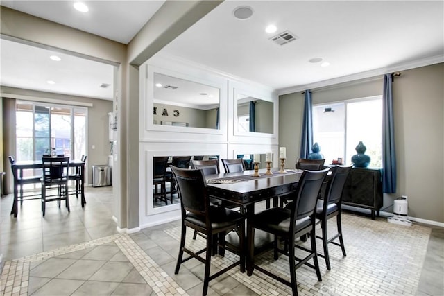 11543 Sky Pointe Dr, Desert Hot Springs, CA 92240 - dining space with ornamental molding, recessed lighting, and light tile patterned floors
