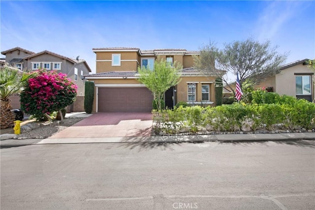 11543 Sky Pointe Dr, Desert Hot Springs, CA 92240 - mediterranean / spanish home with stucco siding, driveway, an attached garage, and a tile roof