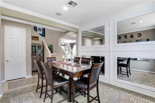 11543 Sky Pointe Dr, Desert Hot Springs, CA 92240 - dining room with light tile patterned floors, inlaid floor details, and ornamental molding