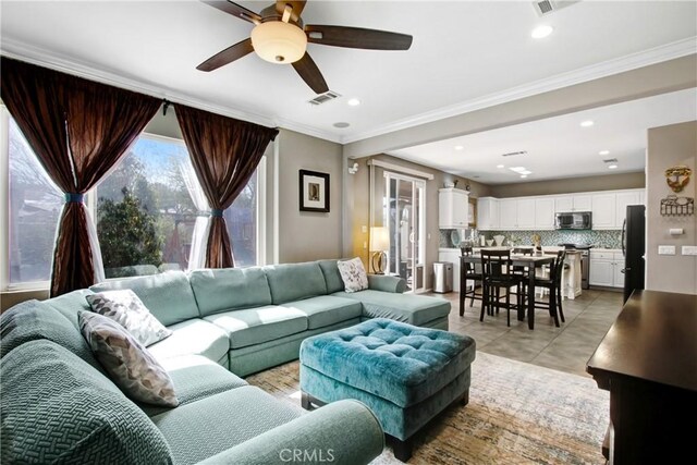 11543 Sky Pointe Dr, Desert Hot Springs, CA 92240 - living area with ceiling fan, light tile patterned floors, ornamental molding, and recessed lighting