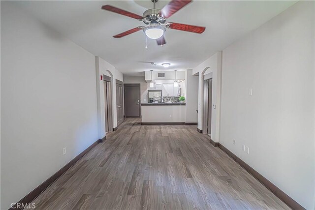24595 Town Center Dr Unit 3205, Valencia, CA 91355 - unfurnished living room with a ceiling fan and wood finished floors