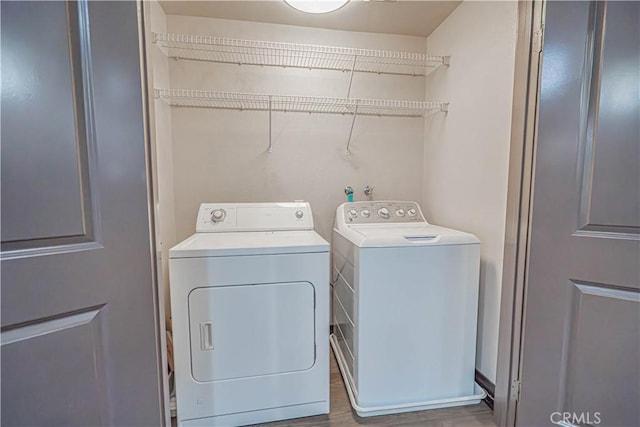 24595 Town Center Dr Unit 3205, Valencia, CA 91355 - laundry room featuring washer and clothes dryer and wood finished floors