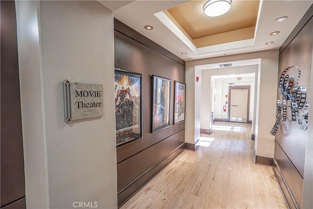 24595 Town Center Dr Unit 3205, Valencia, CA 91355 - hallway featuring a tray ceiling, light wood-style flooring, and recessed lighting