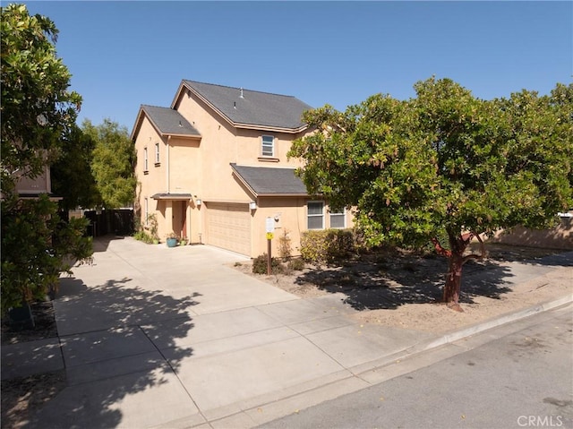 249 Colt Ln, Nipomo, CA 93444 - view of front of house with stucco siding, concrete driveway, and a garage