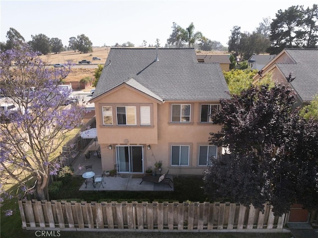 249 Colt Ln, Nipomo, CA 93444 - rear view of house featuring a patio area, stucco siding, and a shingled roof