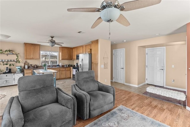 249 Colt Ln, Nipomo, CA 93444 - living area with a ceiling fan and light wood-type flooring