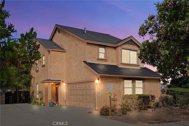 249 Colt Ln, Nipomo, CA 93444 - view of front of home featuring stucco siding, concrete driveway, and an attached garage