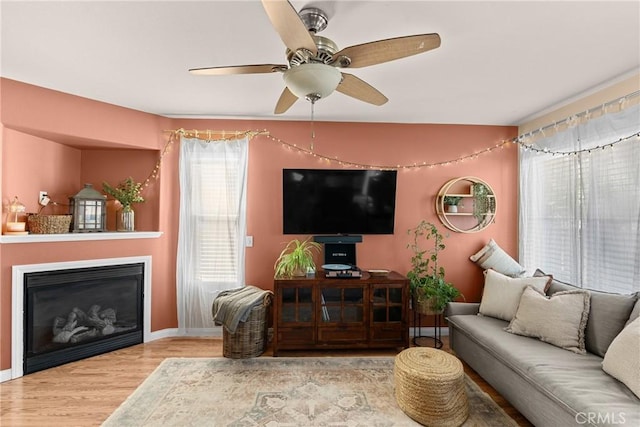 249 Colt Ln, Nipomo, CA 93444 - living area featuring wood finished floors, a ceiling fan, and a glass covered fireplace