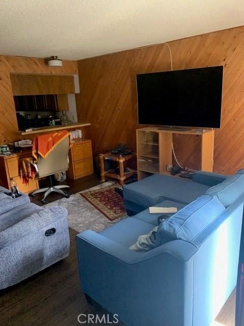 1317 W Cypress Ave Unit A2, Lompoc, CA 93436 - living room featuring wooden walls and wood finished floors