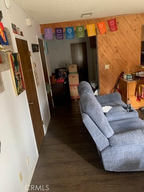 1317 W Cypress Ave Unit A2, Lompoc, CA 93436 - living room with wood finished floors and wood walls