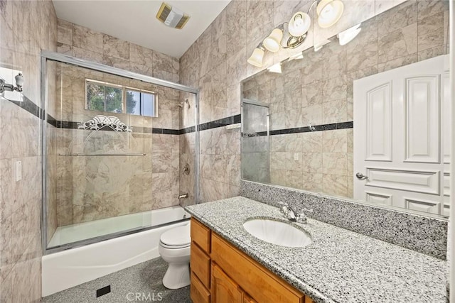 1118 S 6th Ave, Arcadia, CA 91006 - bathroom featuring vanity, combined bath / shower with glass door, and tile walls