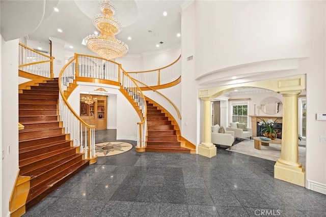 1118 S 6th Ave, Arcadia, CA 91006 - entrance foyer with granite tiled floors, stairs, decorative columns, a high ceiling, and crown molding