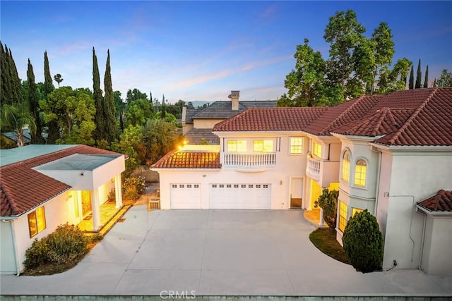1118 S 6th Ave, Arcadia, CA 91006 - mediterranean / spanish home with a balcony, a tile roof, driveway, and stucco siding
