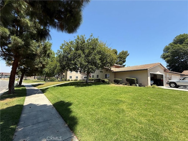 1053 Border Ave, Corona, CA 92882 - view of front facade with a front lawn, a garage, and a tile roof