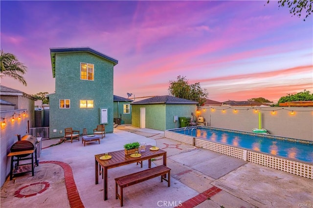 1381 W Summerland Ave, San Pedro, CA 90732 - view of swimming pool featuring a patio, a fenced backyard, and a fire pit
