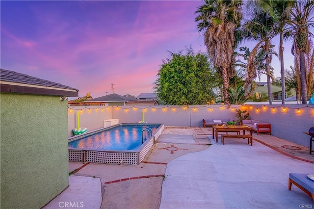 1381 W Summerland Ave, San Pedro, CA 90732 - pool at dusk with outdoor lounge area, a patio, and a fenced backyard