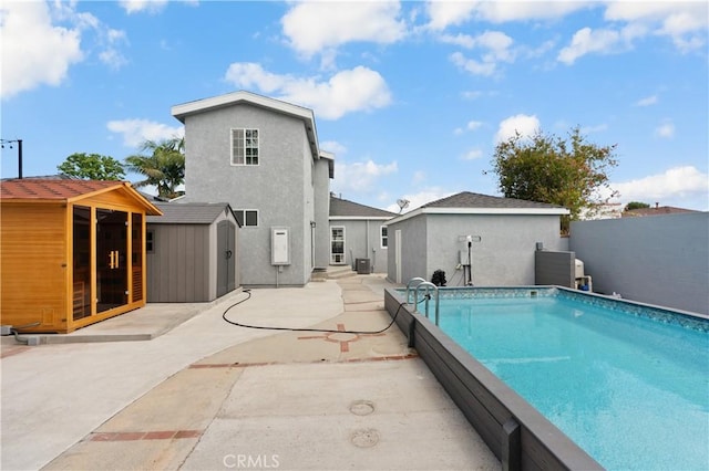 1381 W Summerland Ave, San Pedro, CA 90732 - view of swimming pool with a storage unit and a patio area