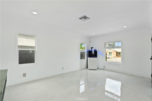 1381 W Summerland Ave, San Pedro, CA 90732 - empty room featuring recessed lighting, water heater, and light marble finish flooring
