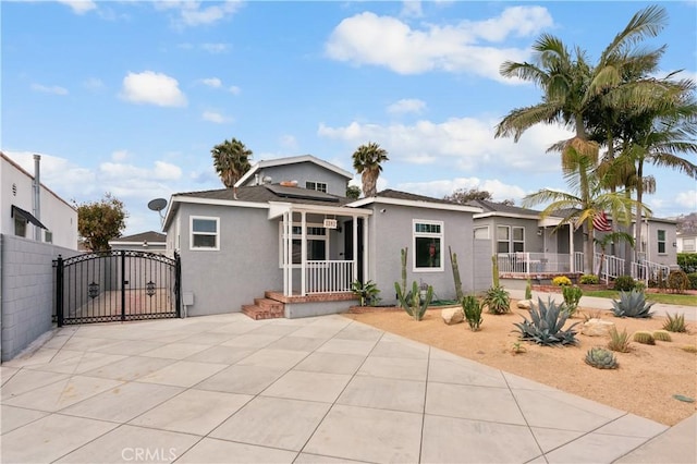 1381 W Summerland Ave, San Pedro, CA 90732 - view of front of home with stucco siding and a gate