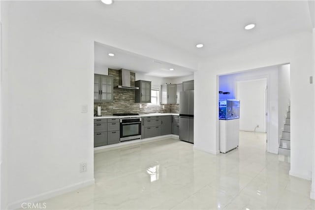 1381 W Summerland Ave, San Pedro, CA 90732 - kitchen with appliances with stainless steel finishes, gray cabinetry, wall chimney range hood, light marble finish floors, and decorative backsplash