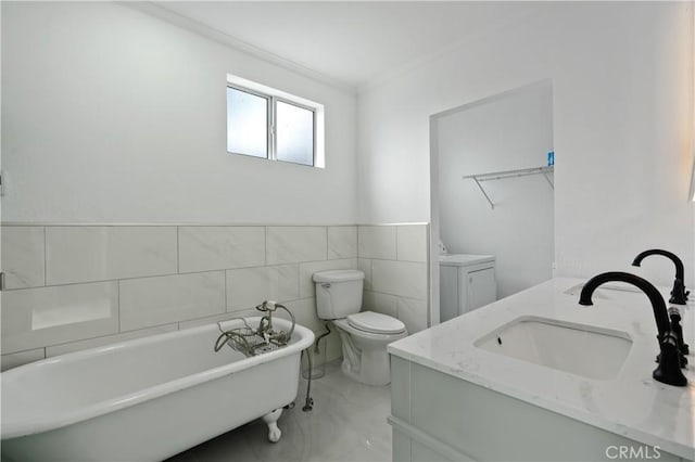 1381 W Summerland Ave, San Pedro, CA 90732 - bathroom with a soaking tub, vanity, marble finish floors, tile walls, and ornamental molding