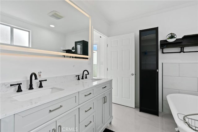 1381 W Summerland Ave, San Pedro, CA 90732 - bathroom with a freestanding bath, double vanity, ornamental molding, and marble finish floors