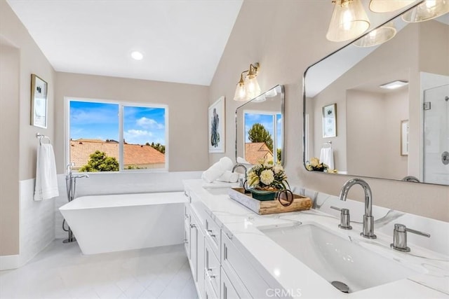 22461 Silver Spur, Lake Forest, CA 92630 - bathroom featuring a freestanding tub, double vanity, tile patterned floors, and recessed lighting