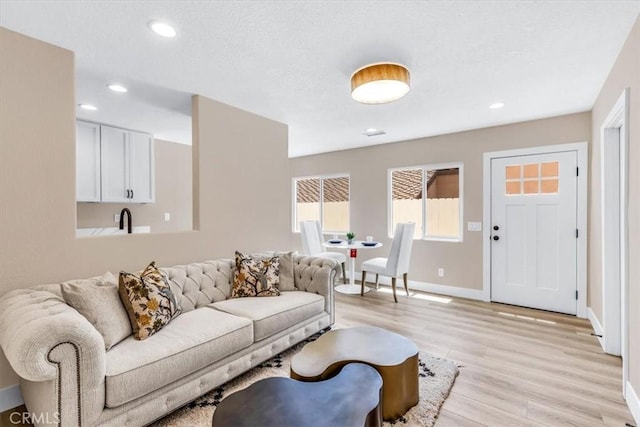 22461 Silver Spur, Lake Forest, CA 92630 - living room featuring light wood-style floors and recessed lighting