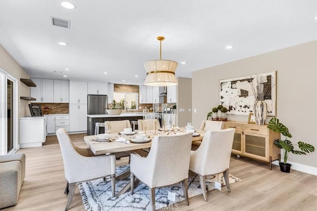 22461 Silver Spur, Lake Forest, CA 92630 - dining space with light wood finished floors and recessed lighting