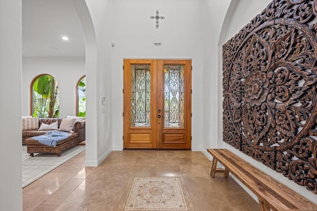 4149 Manchester Ave, Encinitas, CA 92024 - foyer with arched walkways, light tile patterned floors, and a high ceiling