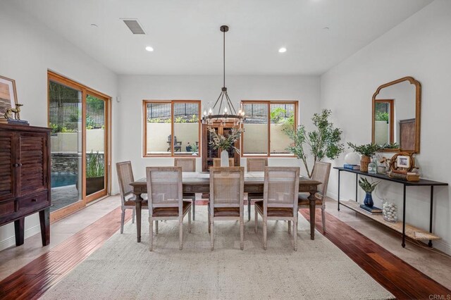 4149 Manchester Ave, Encinitas, CA 92024 - dining space with a chandelier, wood finished floors, and recessed lighting